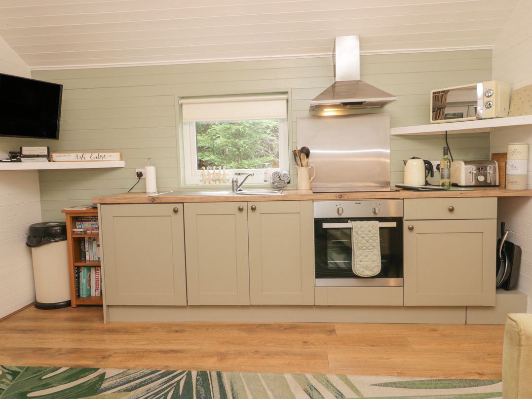 A kitchen with cabinets and appliances at Ash Lodge Pennington near Ulverston