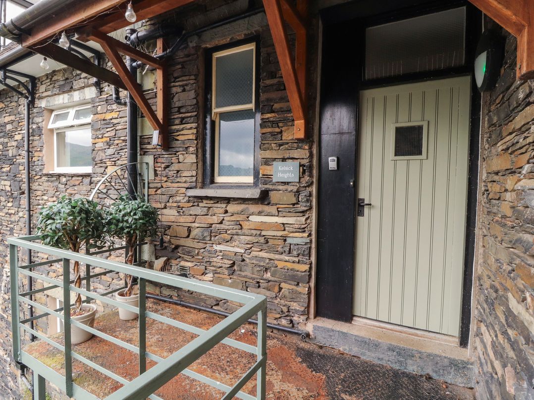 An entrance with a door and plants at Kelsick Heights in Ambleside