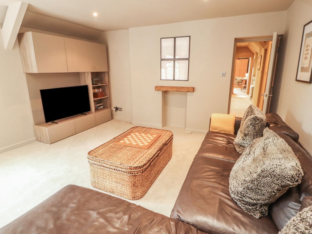 A living room with a sofa and coffee table at Kelsick Heights in Ambleside
