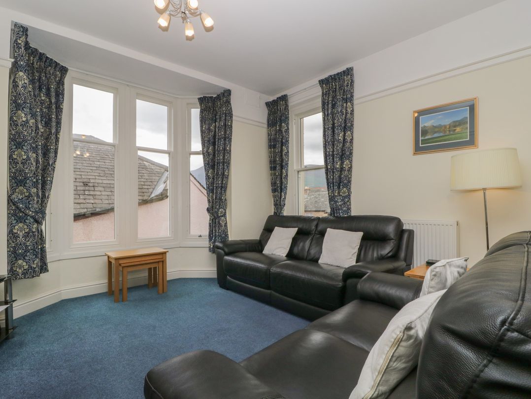 A living room with sofa and table at Amba in Keswick