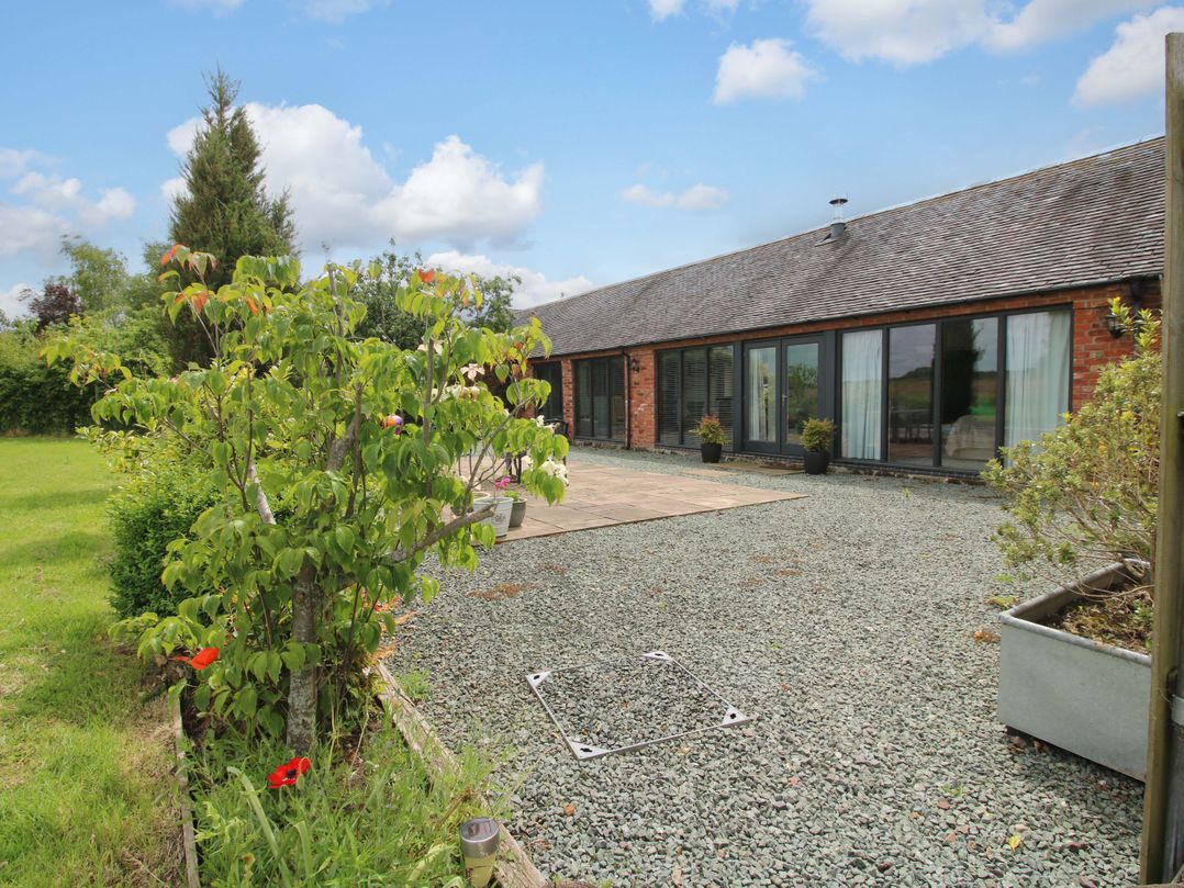 A garden with trees and a pathway at Meeson View in Meeson near Waters Upton