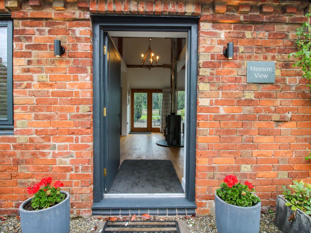 An entrance with a front door and planters at Meeson View near Waters Upton