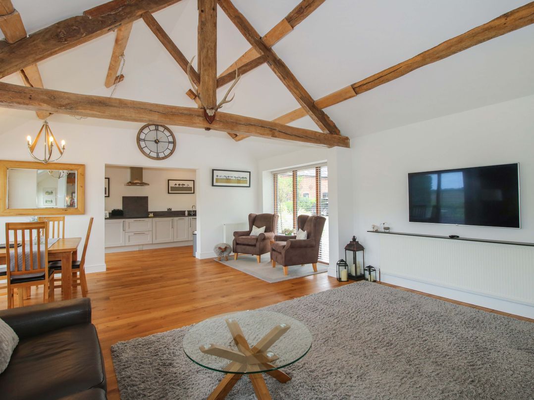 A living room with a dining area and kitchen in Meeson View near Waters Upton