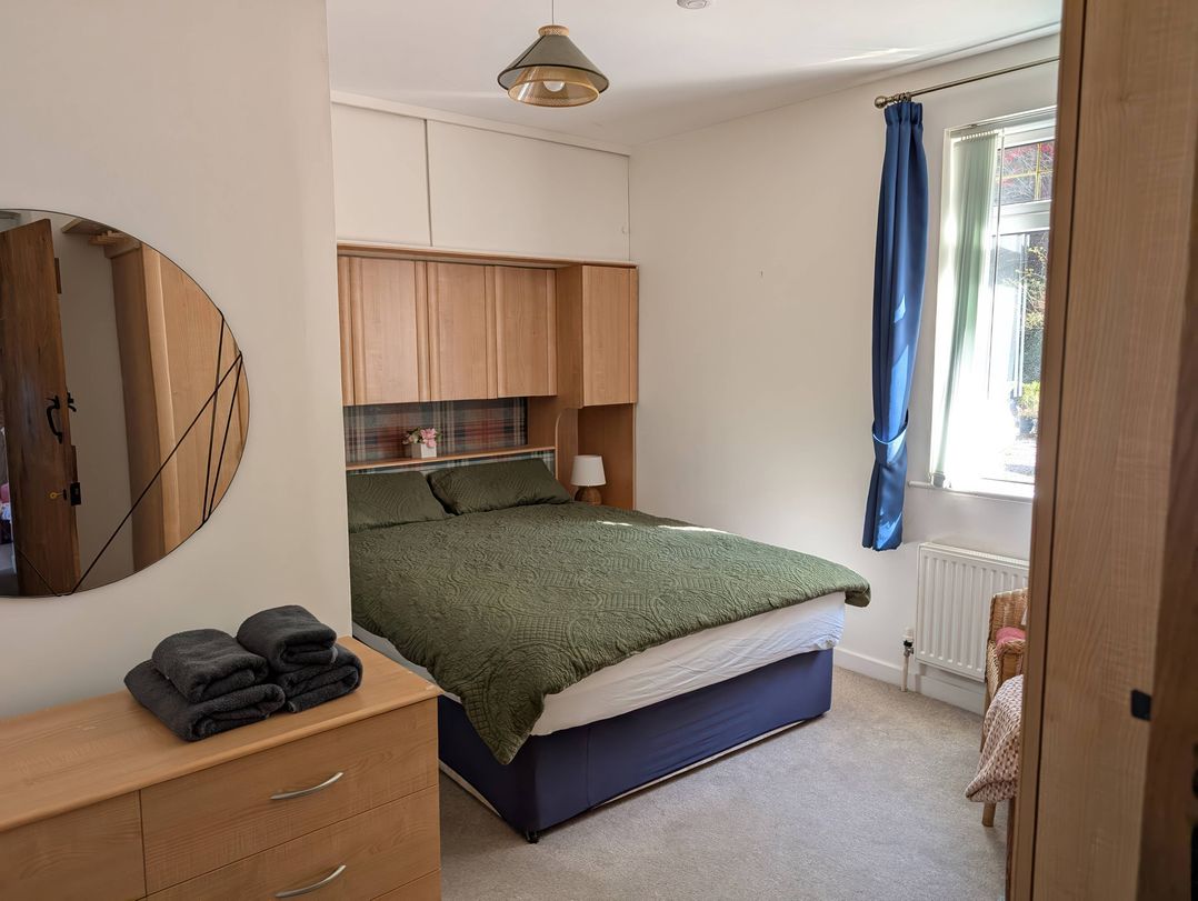 A bedroom with a bed and dresser at Callart View in Glencoe