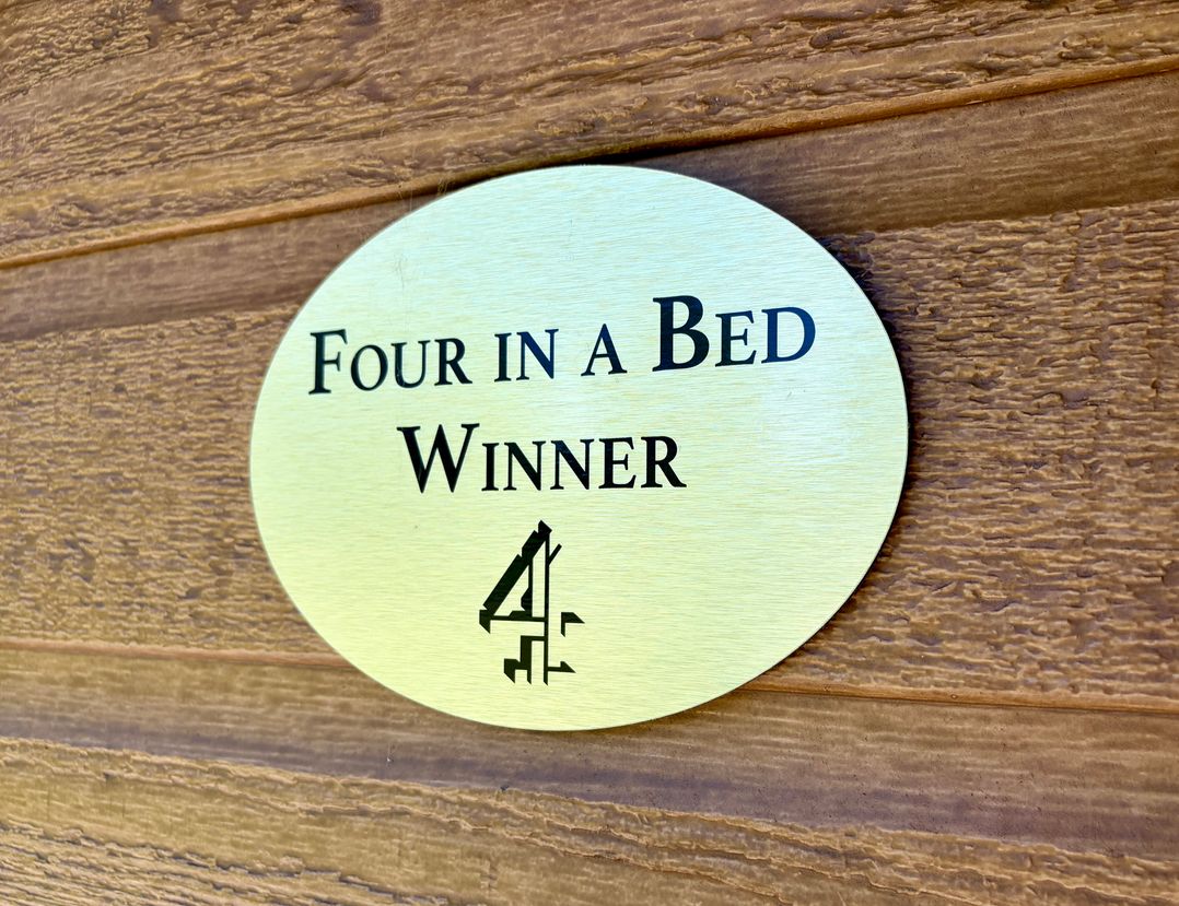 A plaque stating Four in a Bed Winner 4