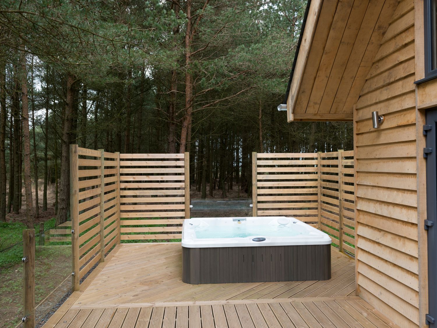 Veranda with outdoor hot tub Verandah with outdoor hot tub at Bracken Howe Lodge ( Ref 1015816 ) Egton Holiday Lodge near Whitby North Yorkshire