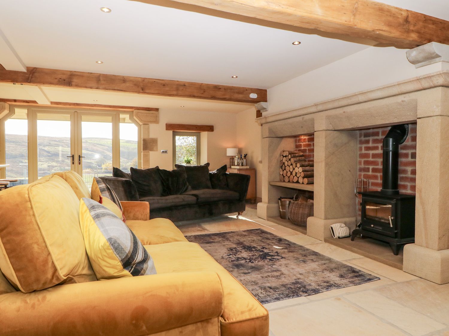 Sitting area with wood-burner at The Old Shippon Cowling ( Ref 1017543 ) Holiday cottage at The Old Shippon Cottages Cowling North Yorkshire
