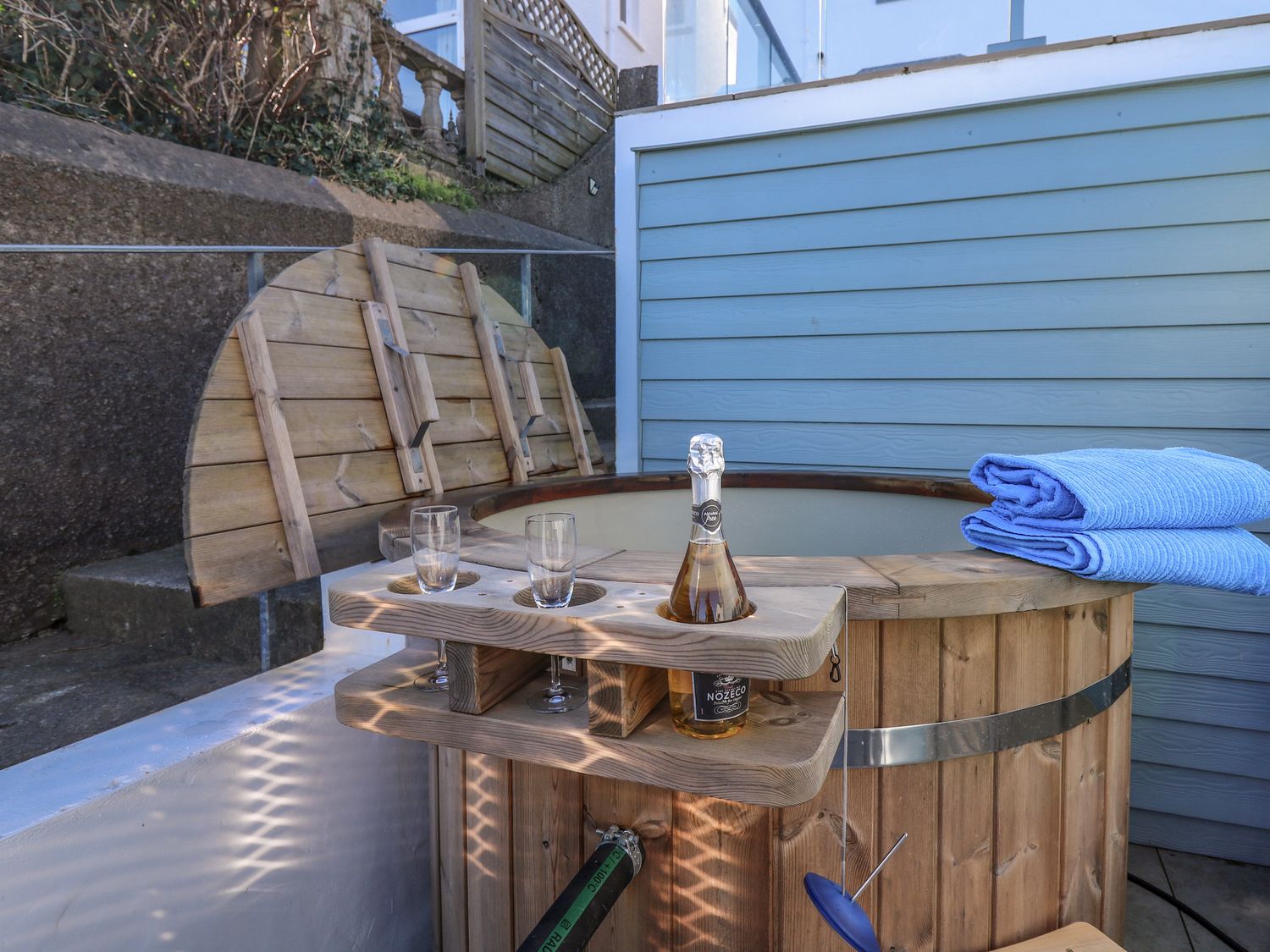 Fronwig is located in New Quay, Ceredigion. Four-bedroom home with sea views and wood-fired hot tub.