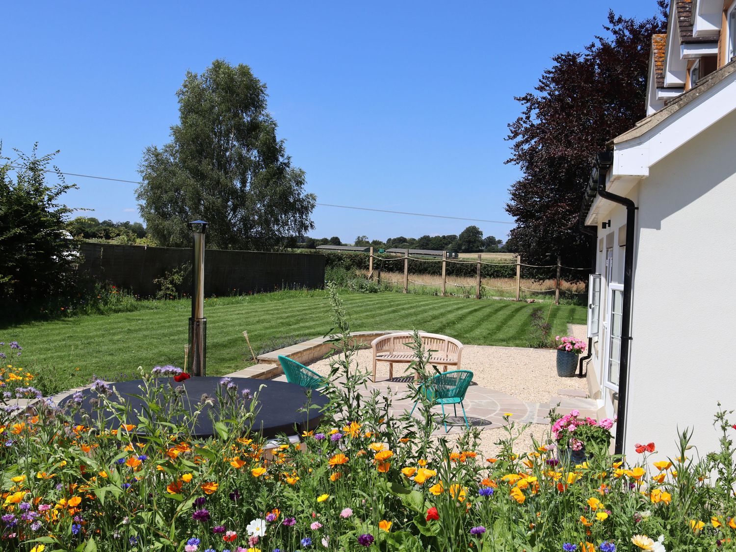 Leafield House in Upper Seagry, Wiltshire. Hot tub. Cinema room. Library. Freestanding bath. Luxury.