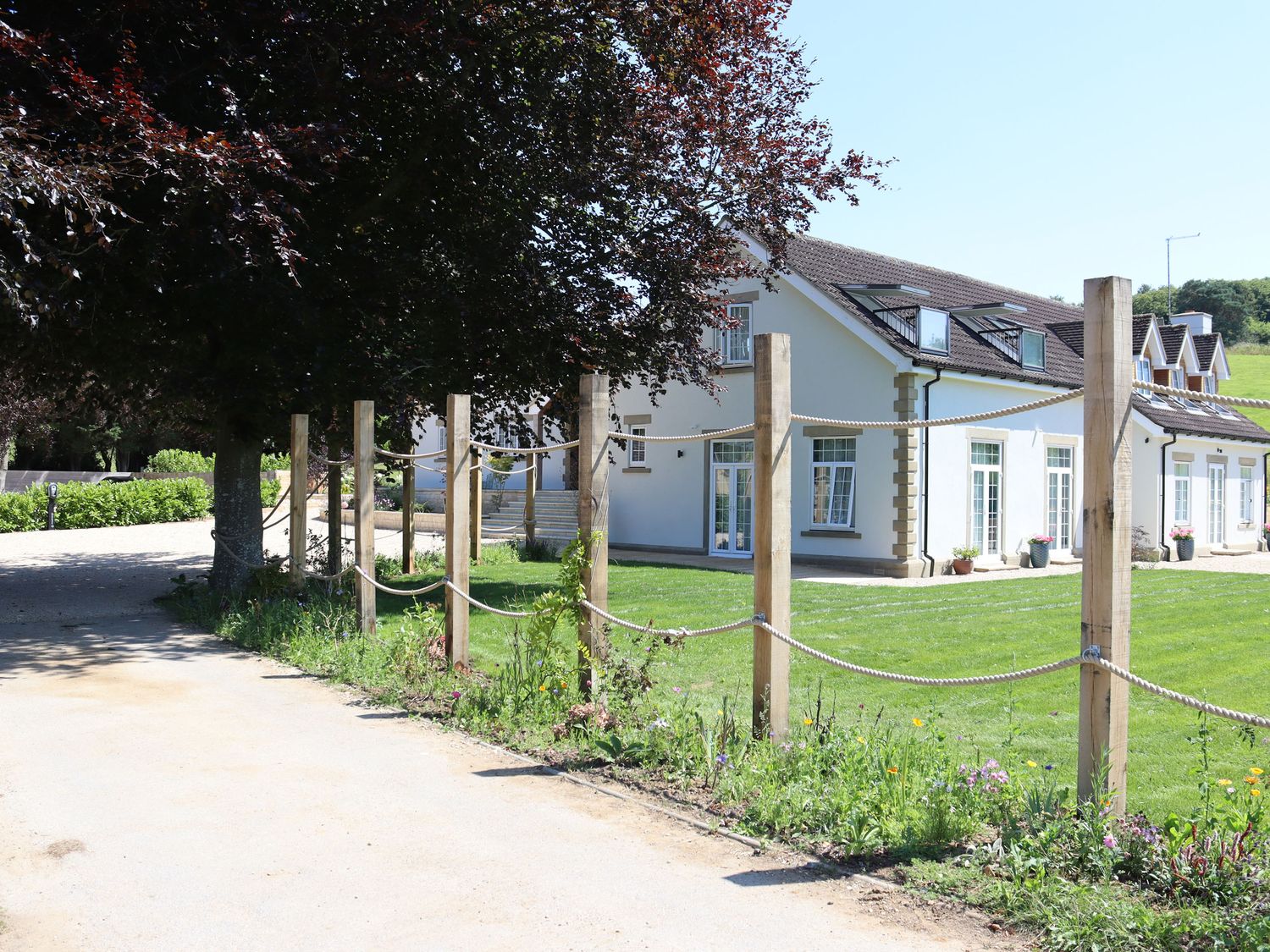 Leafield House in Upper Seagry, Wiltshire. Hot tub. Cinema room. Library. Freestanding bath. Luxury.