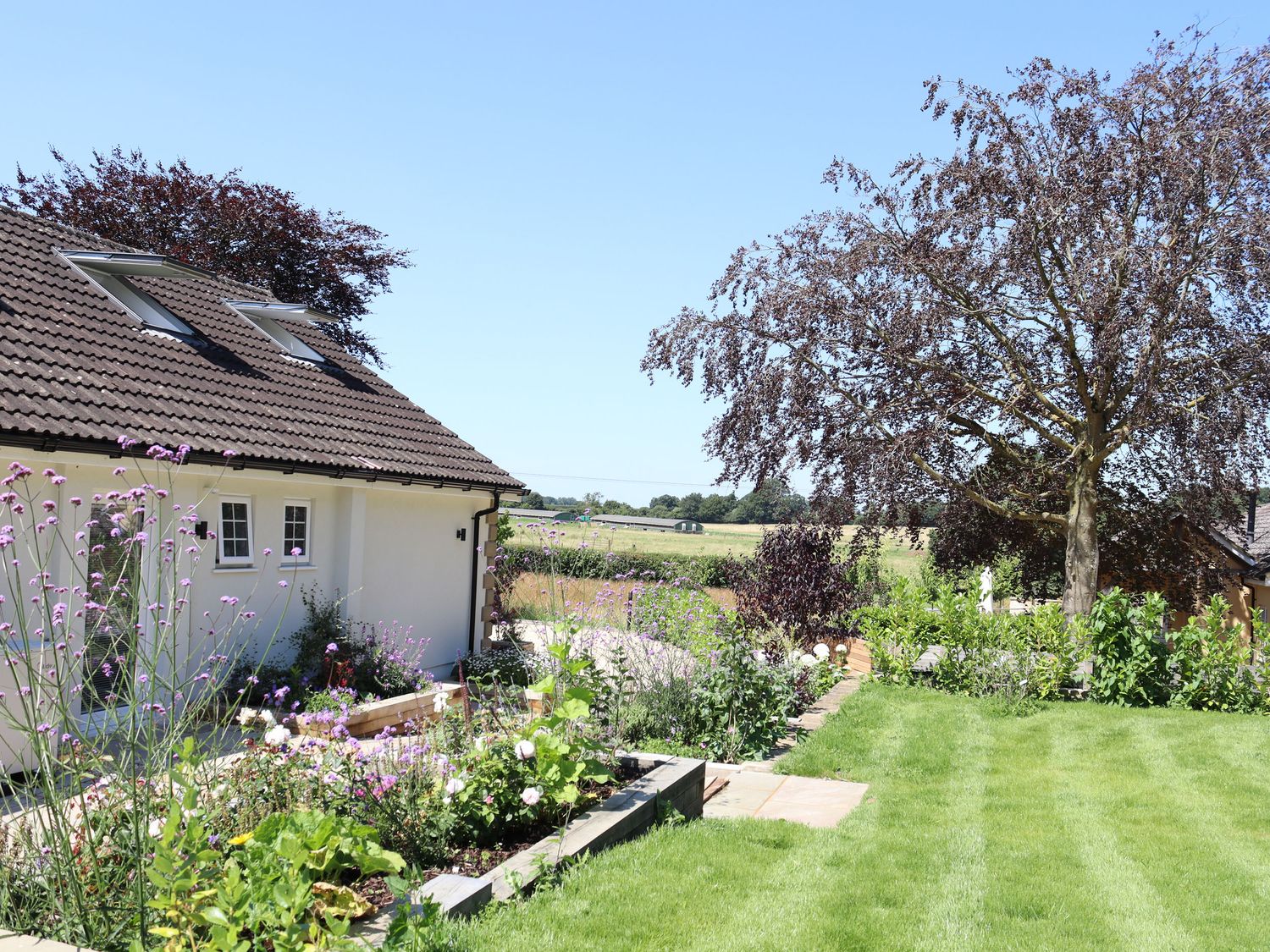 Leafield House in Upper Seagry, Wiltshire. Hot tub. Cinema room. Library. Freestanding bath. Luxury.