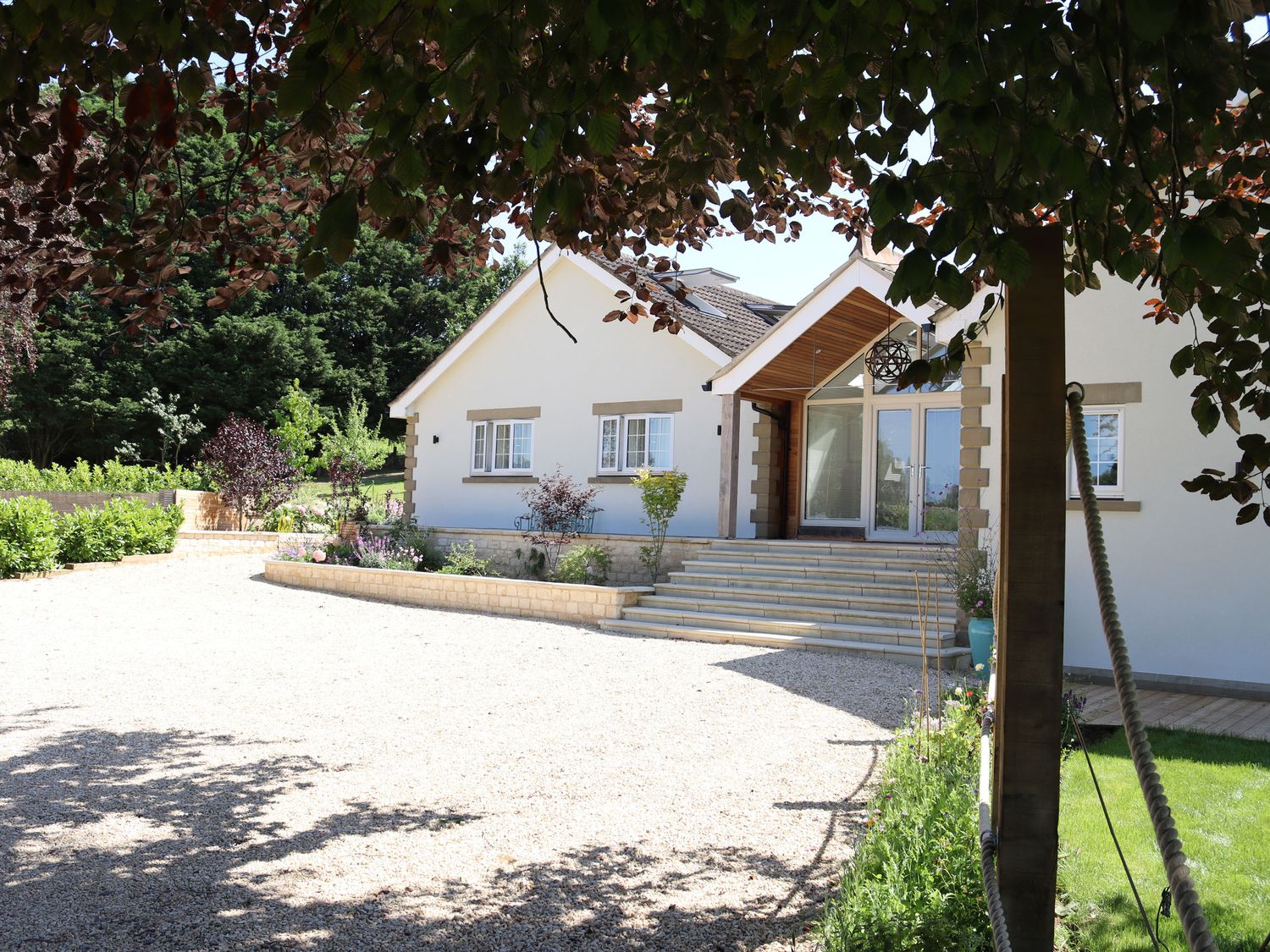 Leafield House in Upper Seagry, Wiltshire. Hot tub. Cinema room. Library. Freestanding bath. Luxury.