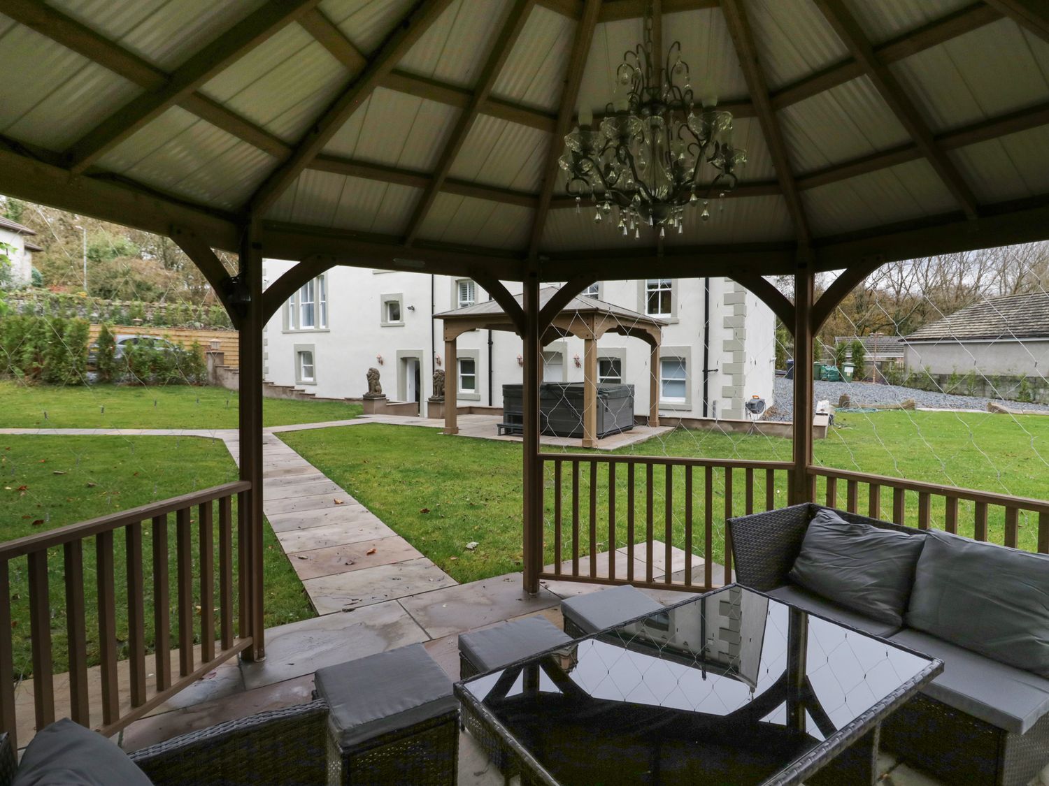 Beechgrove Manor in Workington, Cumbria. Hot tub. Woodburning stove. Near coast. Smart TV. En-suite.