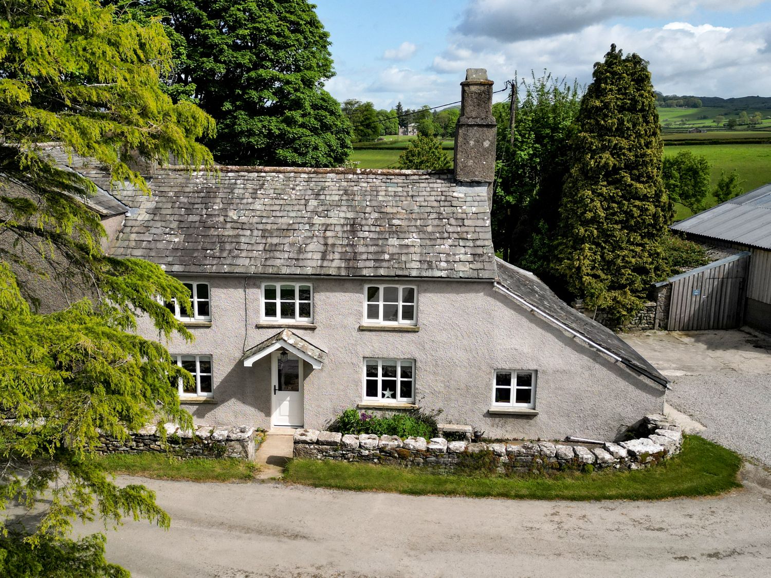 Longlands Farm Cottage, Cartmel, historic building, character, hot tub, rural location, lawned area.