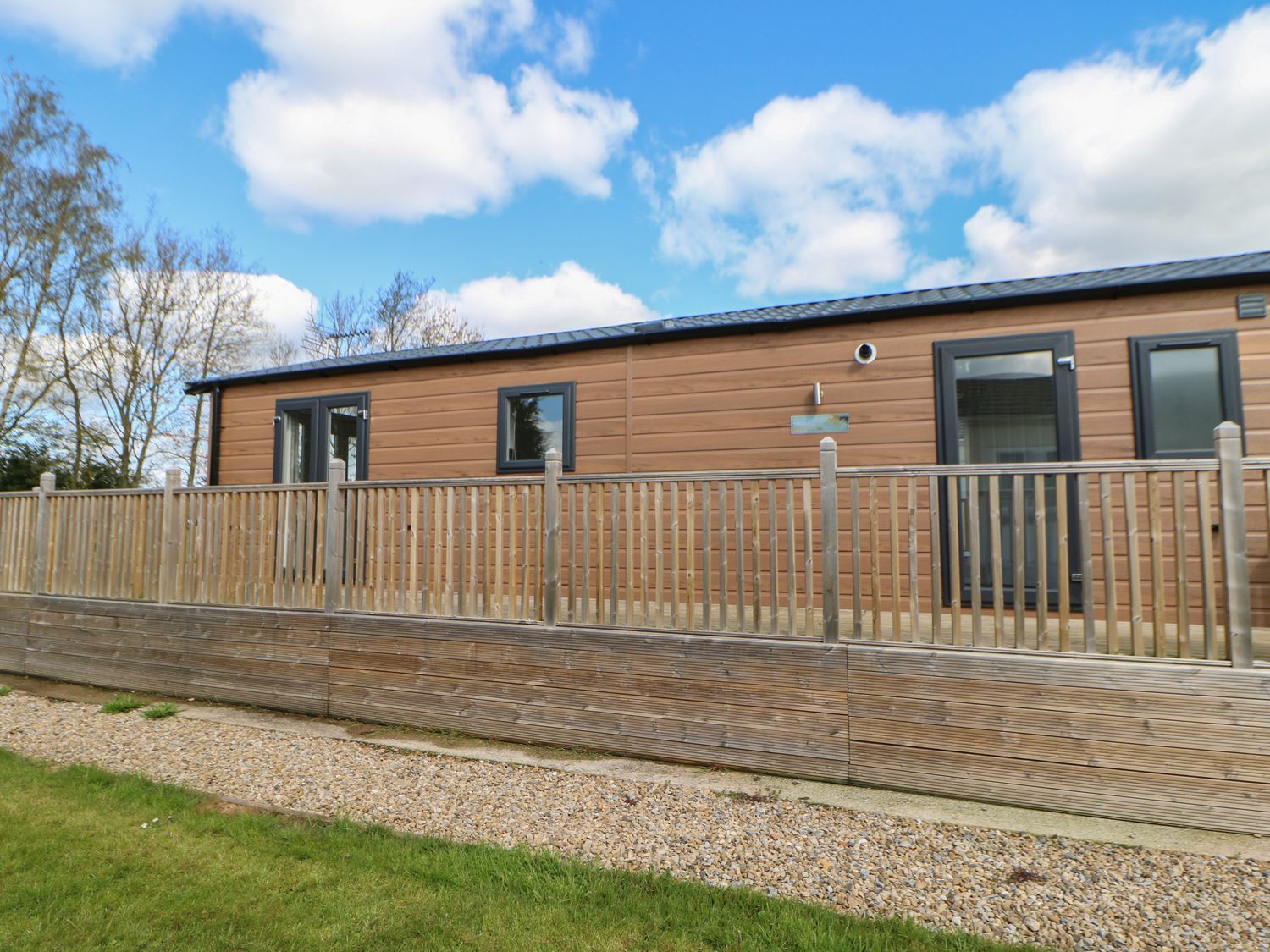 Coverdale Large Pod, Hutton Rudby,Yorkshire. Open-plan living. Decking with furniture and hot tub. 