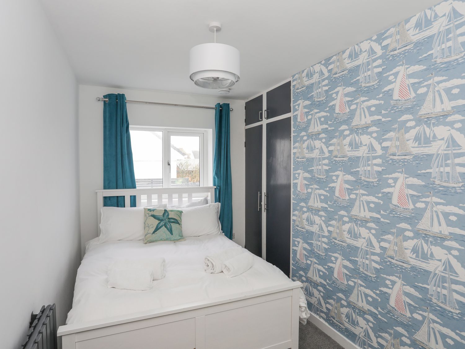 Clydfan, No 1 Trearddur Road in Trearddur Bay on the Isle of Anglesey. Pet-friendly cottage. Hot tub