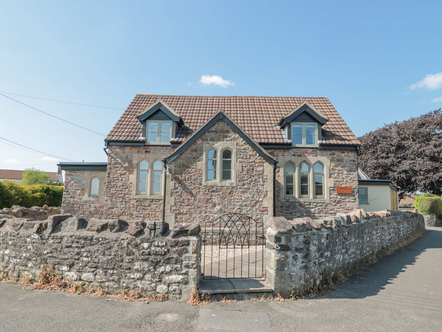 The Old Schoolrooms, in Holcombe, Somerset. Four-bedroom home with games room and hot tub. Pet-free.