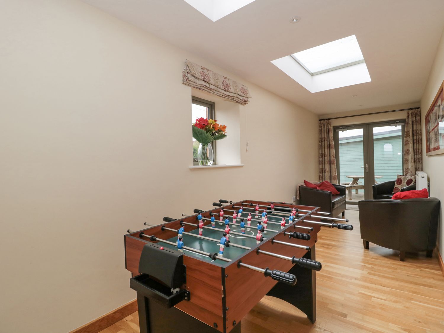 The Old Schoolrooms, in Holcombe, Somerset. Four-bedroom home with games room and hot tub. Pet-free.
