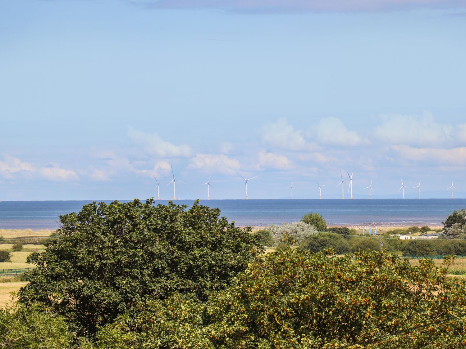 The Stargazer in Gronant, Denbighshire. One-bedroom, stylish home with distant sea views. Near beach