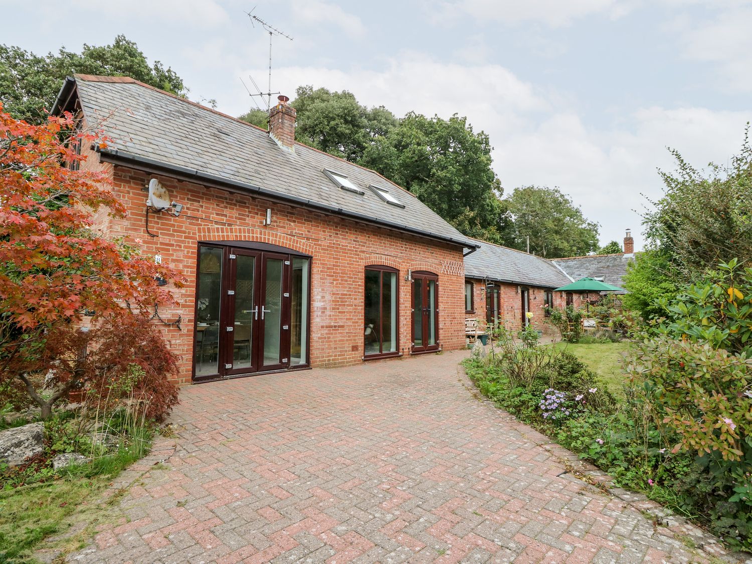 Northern Byre rests in Sopley, Hampshire. Four-bedroom barn conversion, resting near amenities. Pets