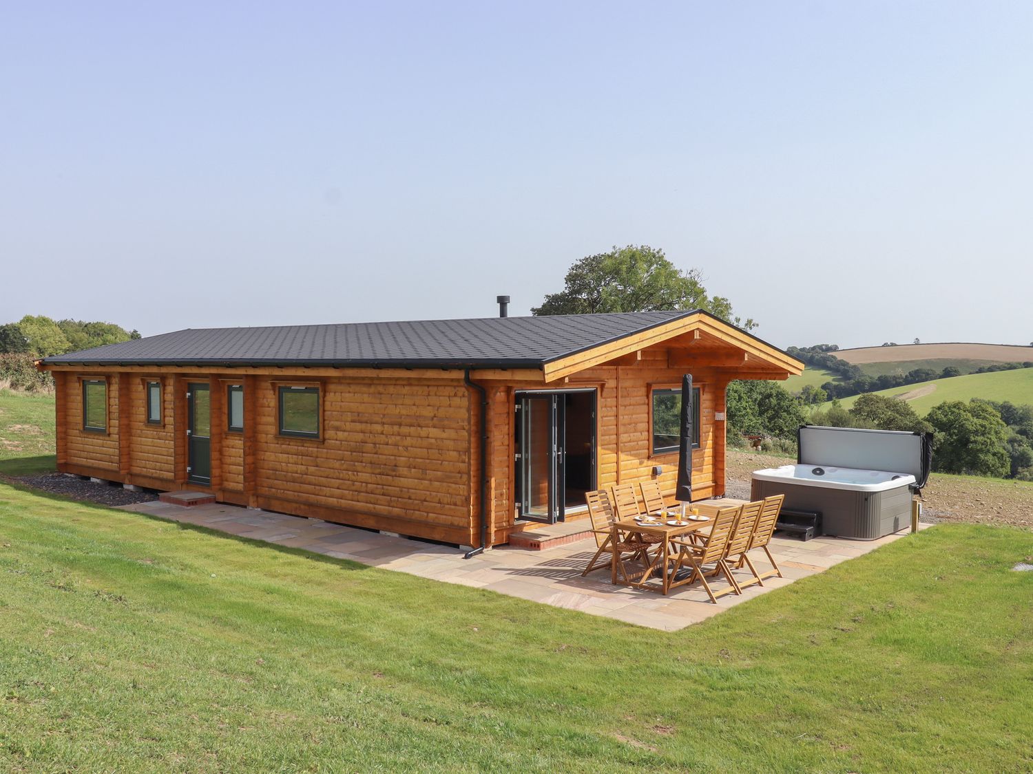 Bluebell Lodge in Hittisleigh, Devon. Three bedrooms. Norwegian design. Rural location & woodburner.