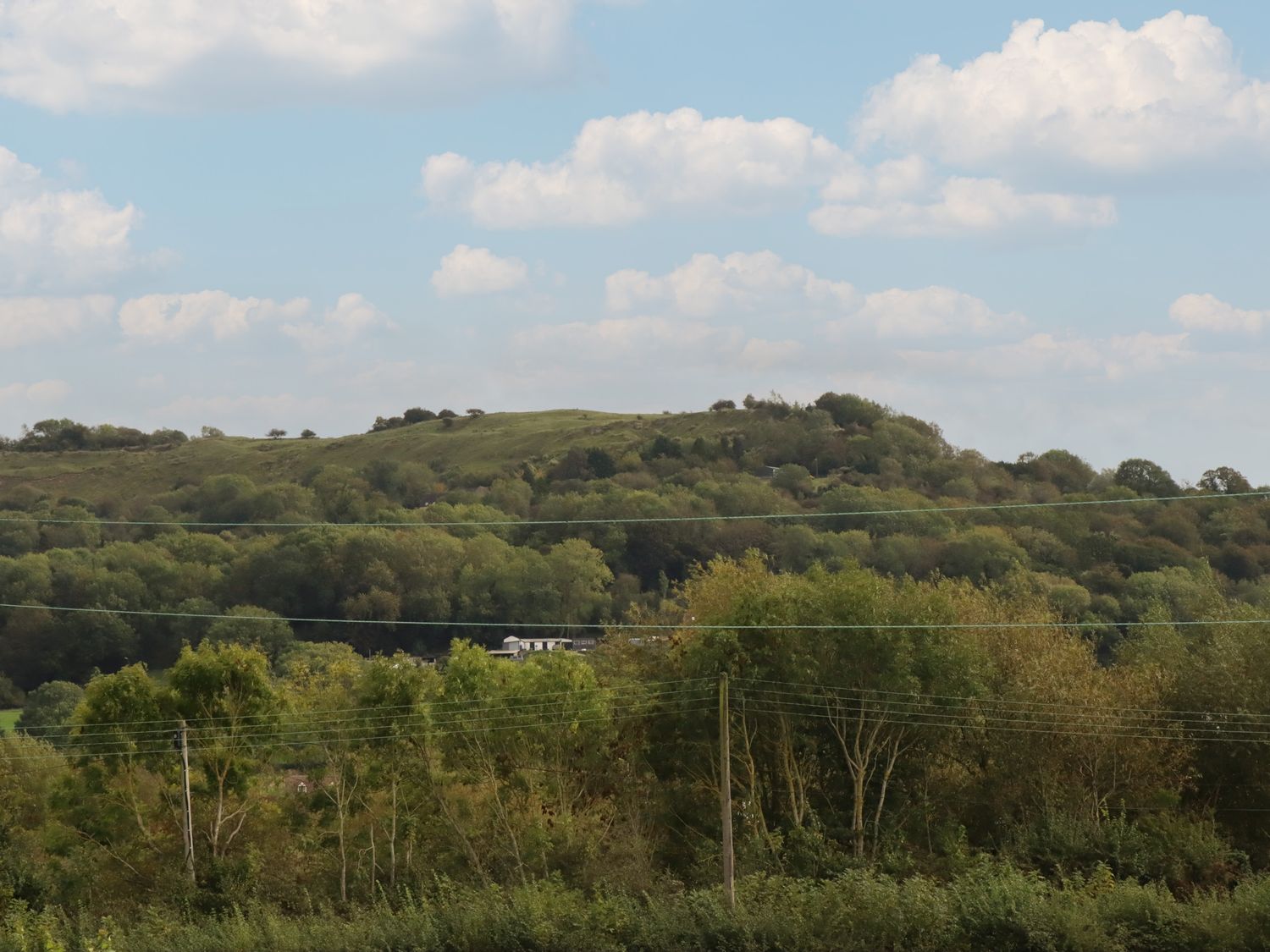 The Firs, in Brockworth, Gloucestershire. Four-bedroom home with rural views. Hot tub. Pet-friendly.