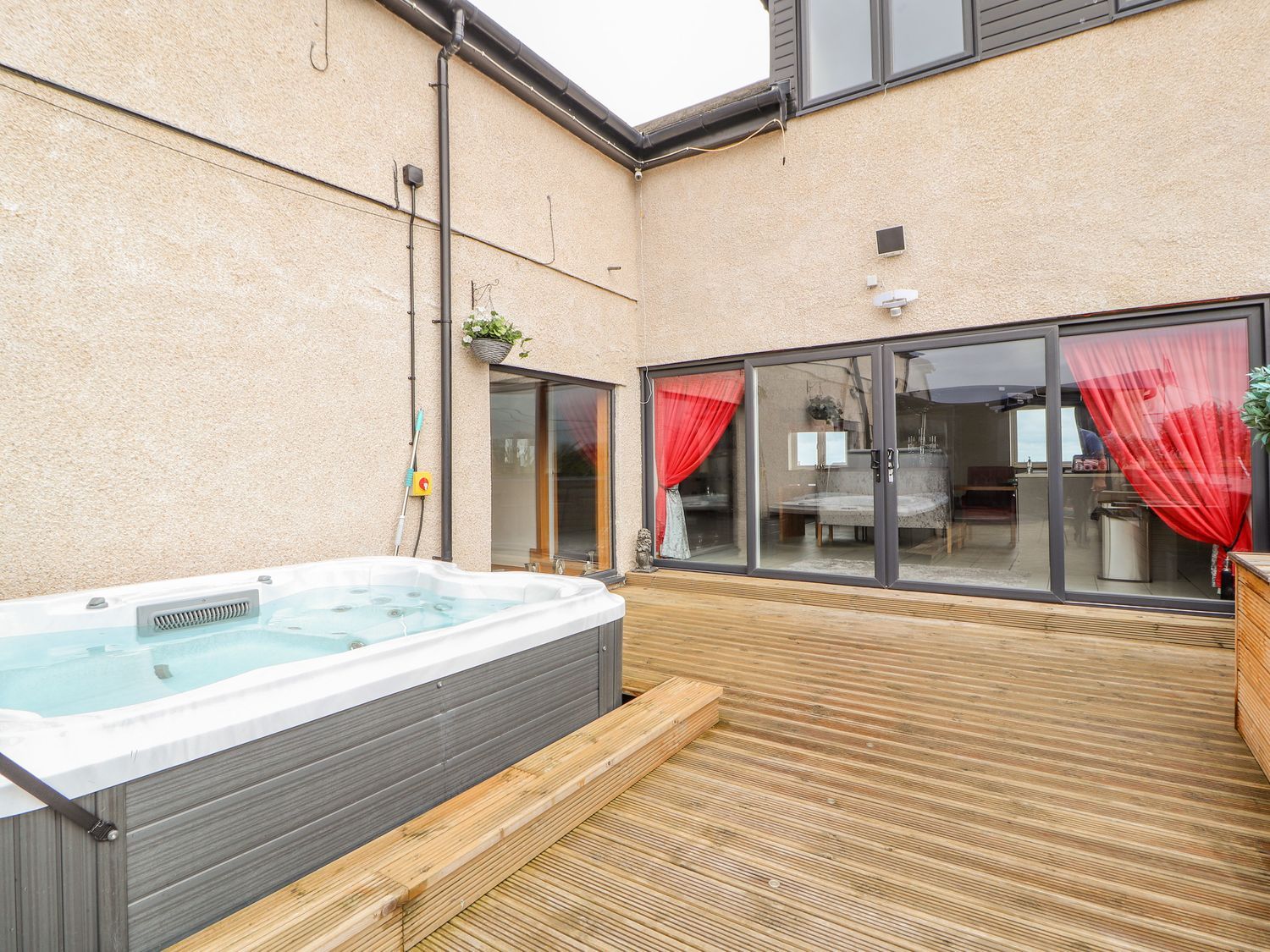 The Wendover in Towyn, Conwy. Large, coastal, duplex apartment with hot tub, games room, and terrace