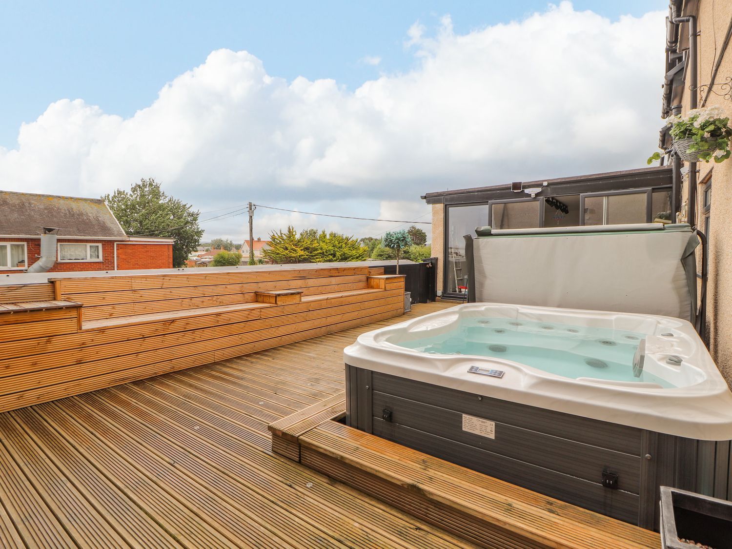 The Wendover in Towyn, Conwy. Large, coastal, duplex apartment with hot tub, games room, and terrace