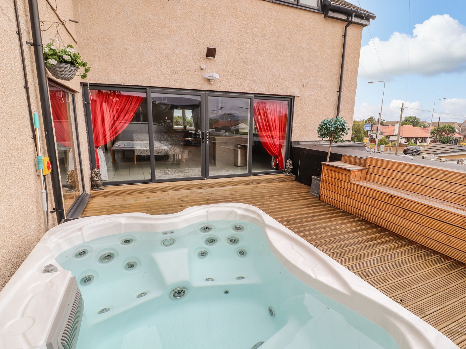 The Wendover in Towyn, Conwy. Large, coastal, duplex apartment with hot tub, games room, and terrace