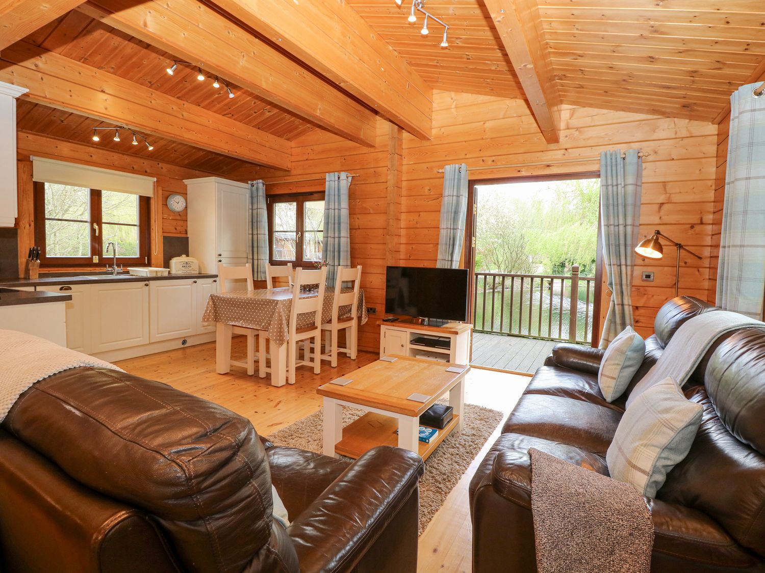 Kingfisher Lodge, in Badwell Ash in Suffolk. Lakeside cabin. Adults only. Remote. Hot tub. Barbecue.