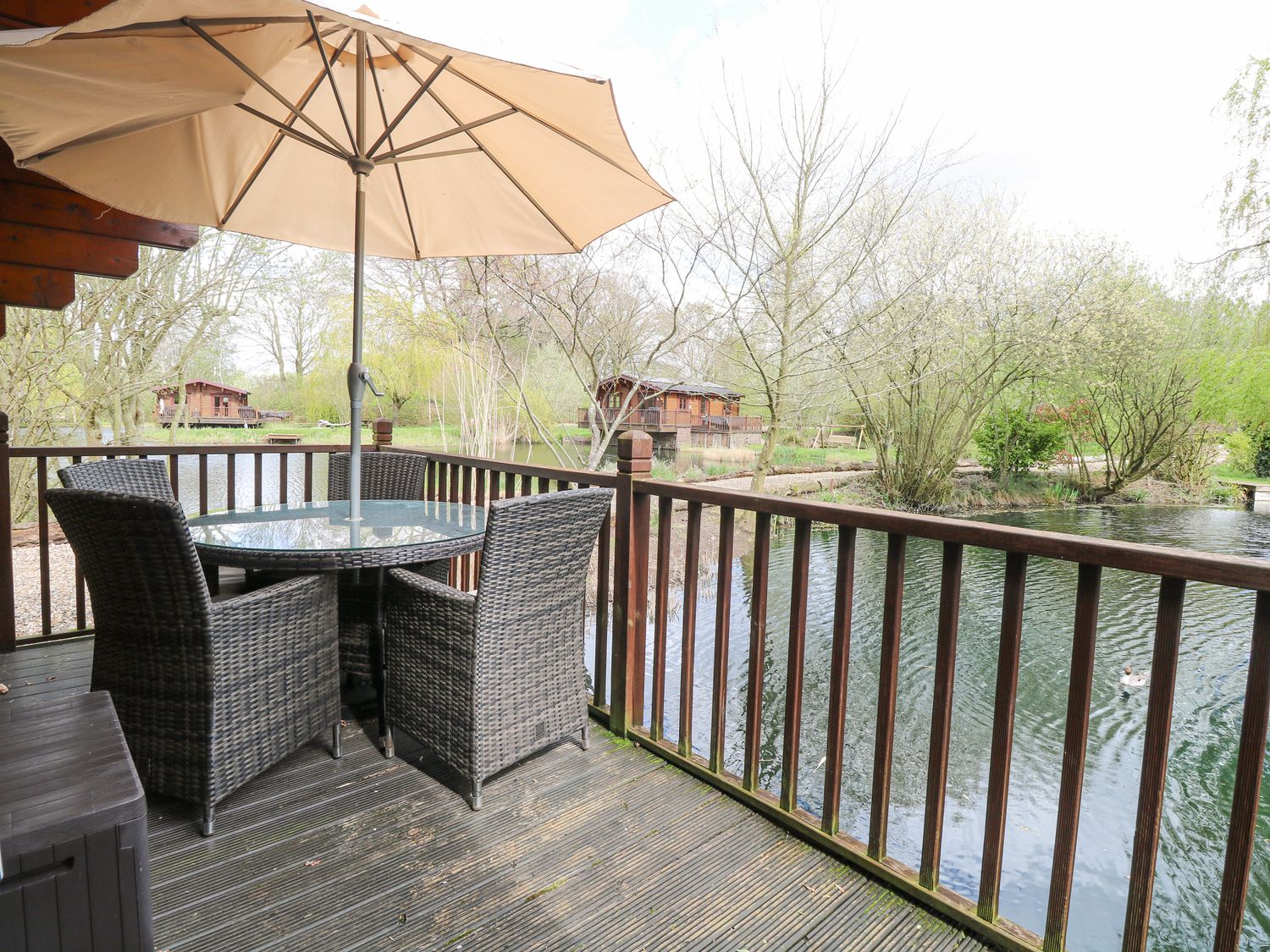 Kingfisher Lodge, in Badwell Ash in Suffolk. Lakeside cabin. Adults only. Remote. Hot tub. Barbecue.