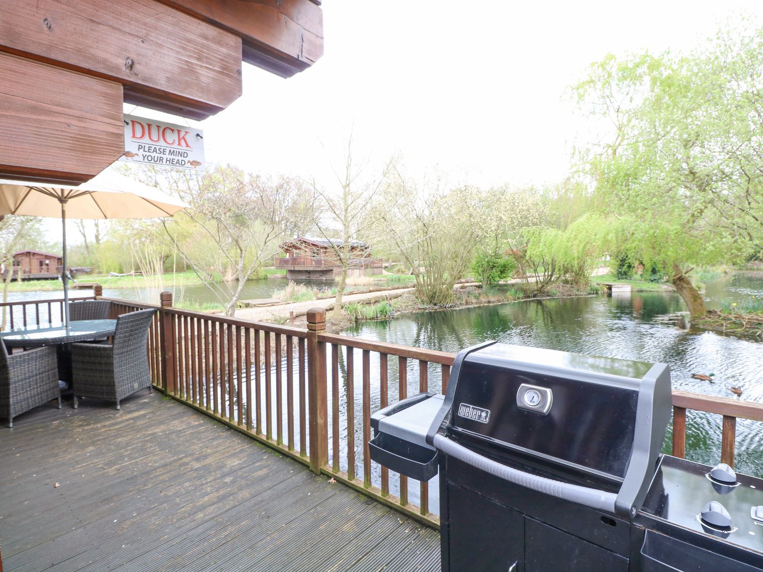 Kingfisher Lodge, in Badwell Ash in Suffolk. Lakeside cabin. Adults only. Remote. Hot tub. Barbecue.