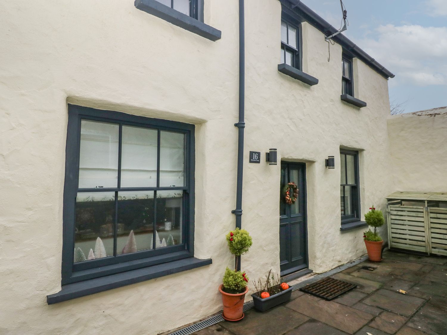 Blacksmiths Cottage rests in Pembrokeshire. Pet-friendly. Hot tub. Cinema room. Woodburning stove.