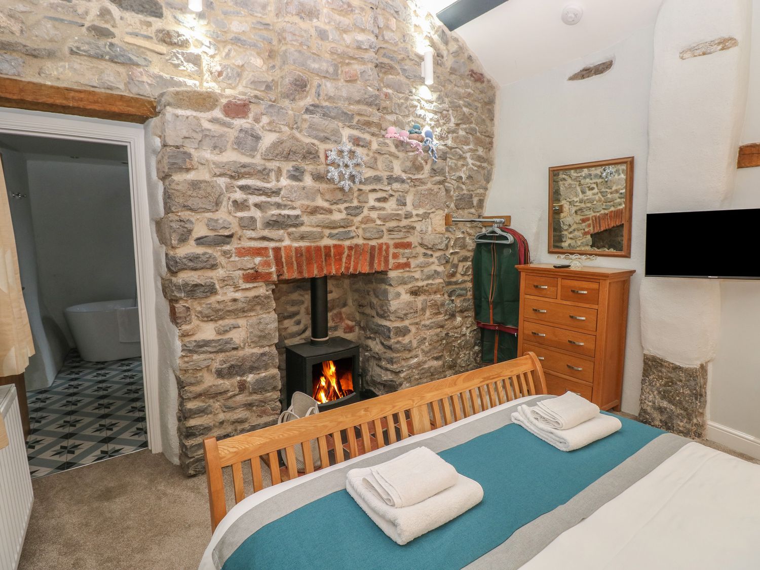 Blacksmiths Cottage rests in Pembrokeshire. Pet-friendly. Hot tub. Cinema room. Woodburning stove.