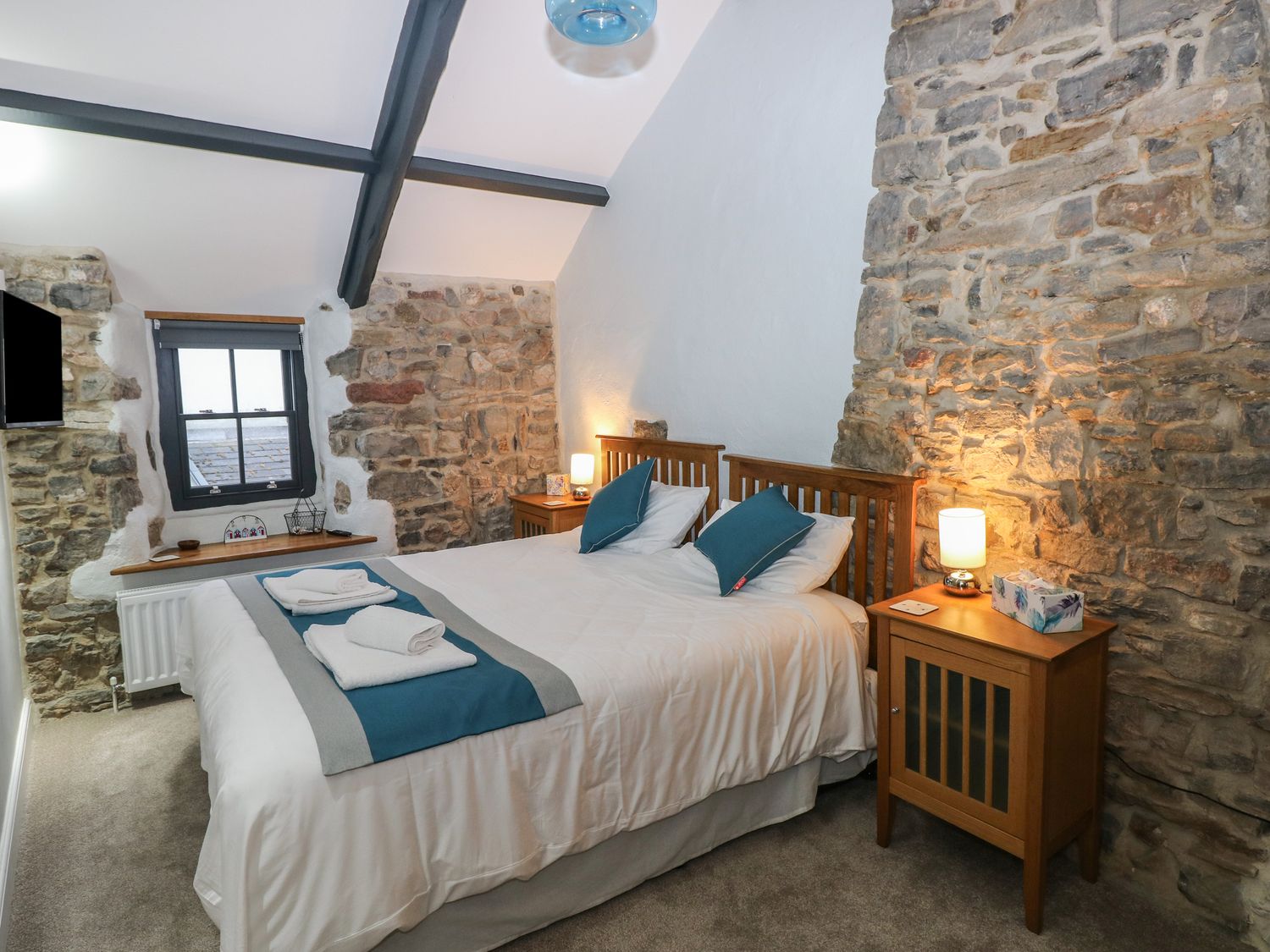 Blacksmiths Cottage rests in Pembrokeshire. Pet-friendly. Hot tub. Cinema room. Woodburning stove.