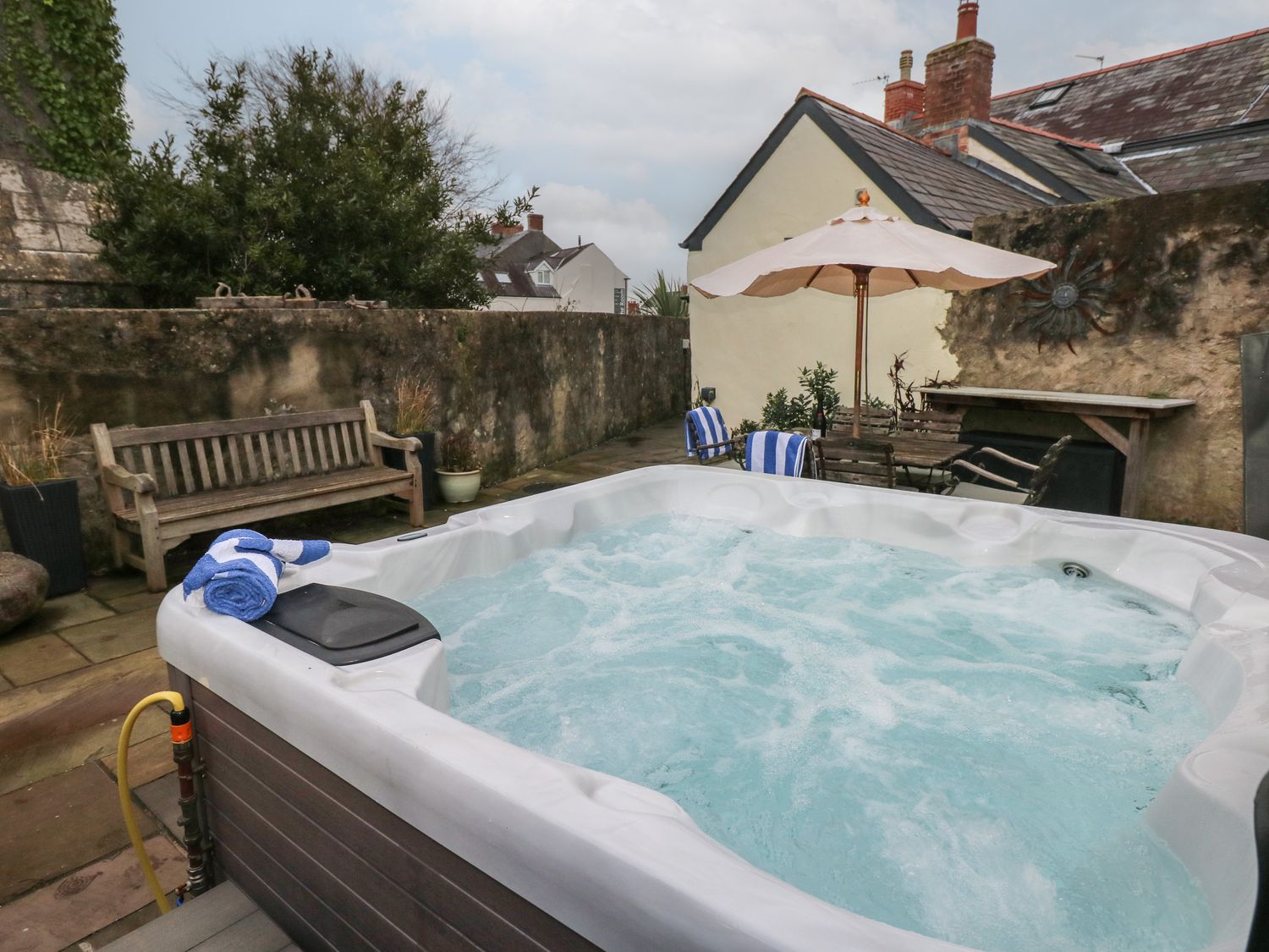 Blacksmiths Cottage rests in Pembrokeshire. Pet-friendly. Hot tub. Cinema room. Woodburning stove.