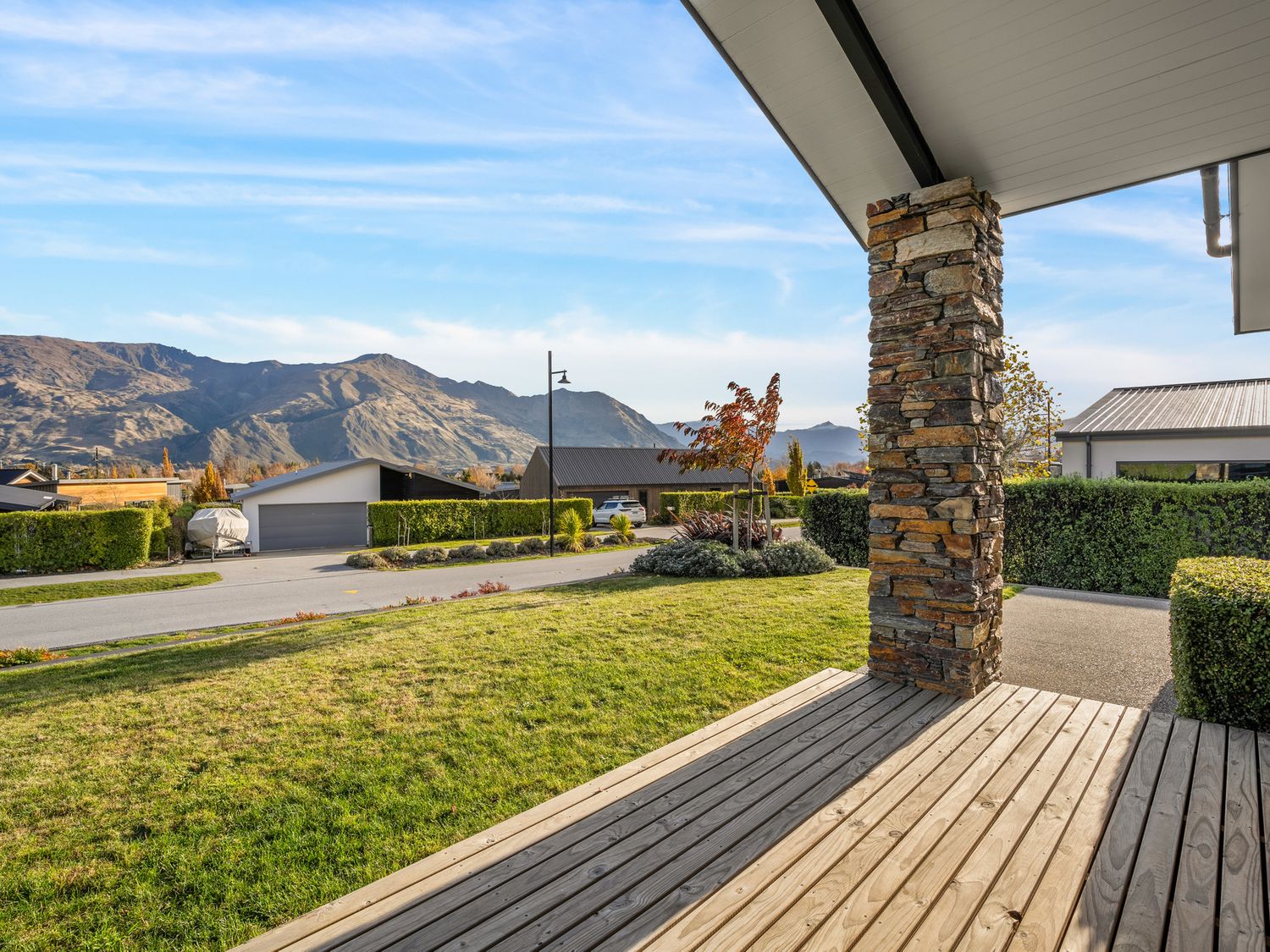 A view of mountains and grass from a deck at Mako Haven - Mountain Outlook in Wanaka