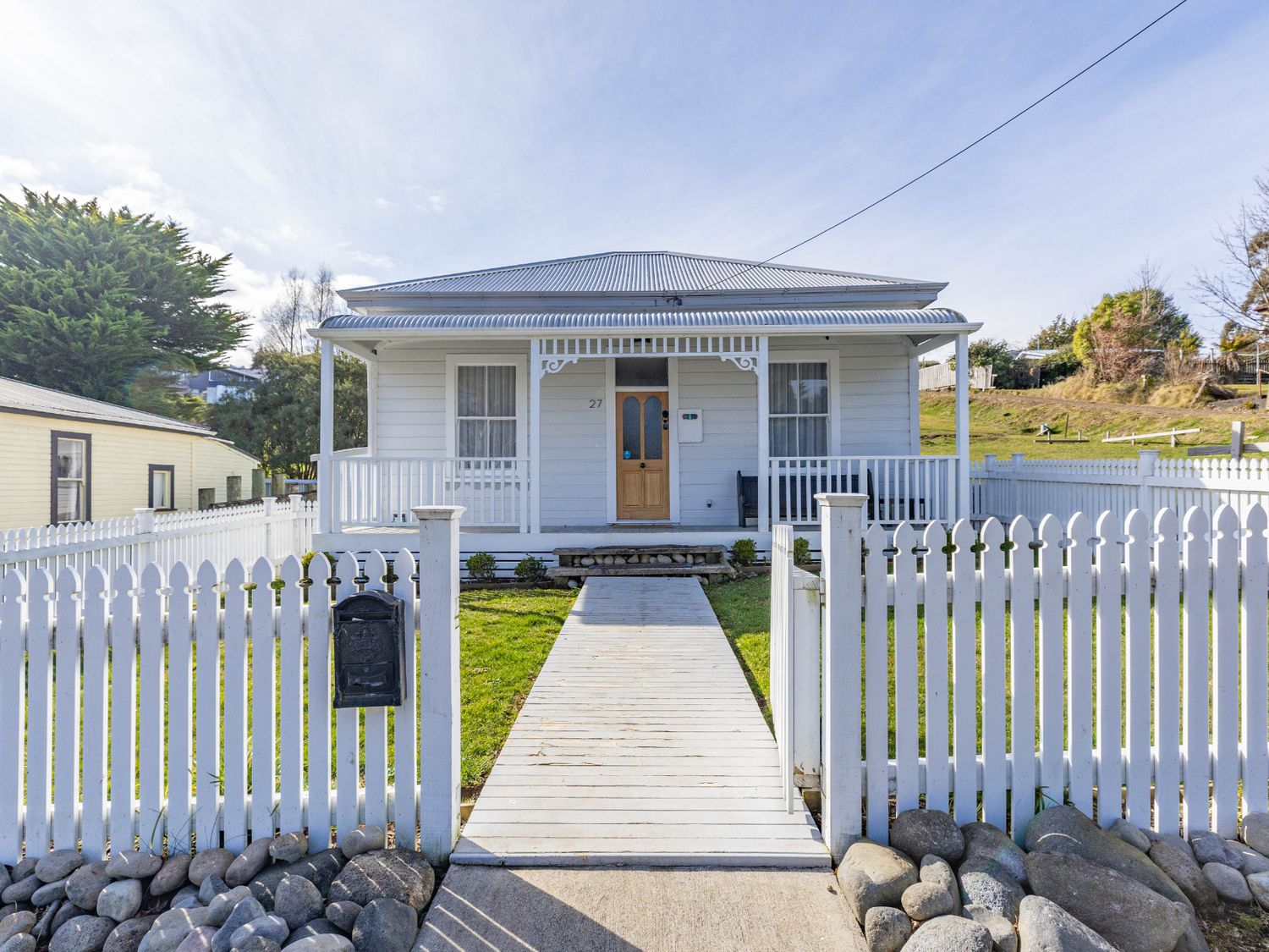 A house with a front porch and pathway at Ohakune Holiday Home in Ohakune