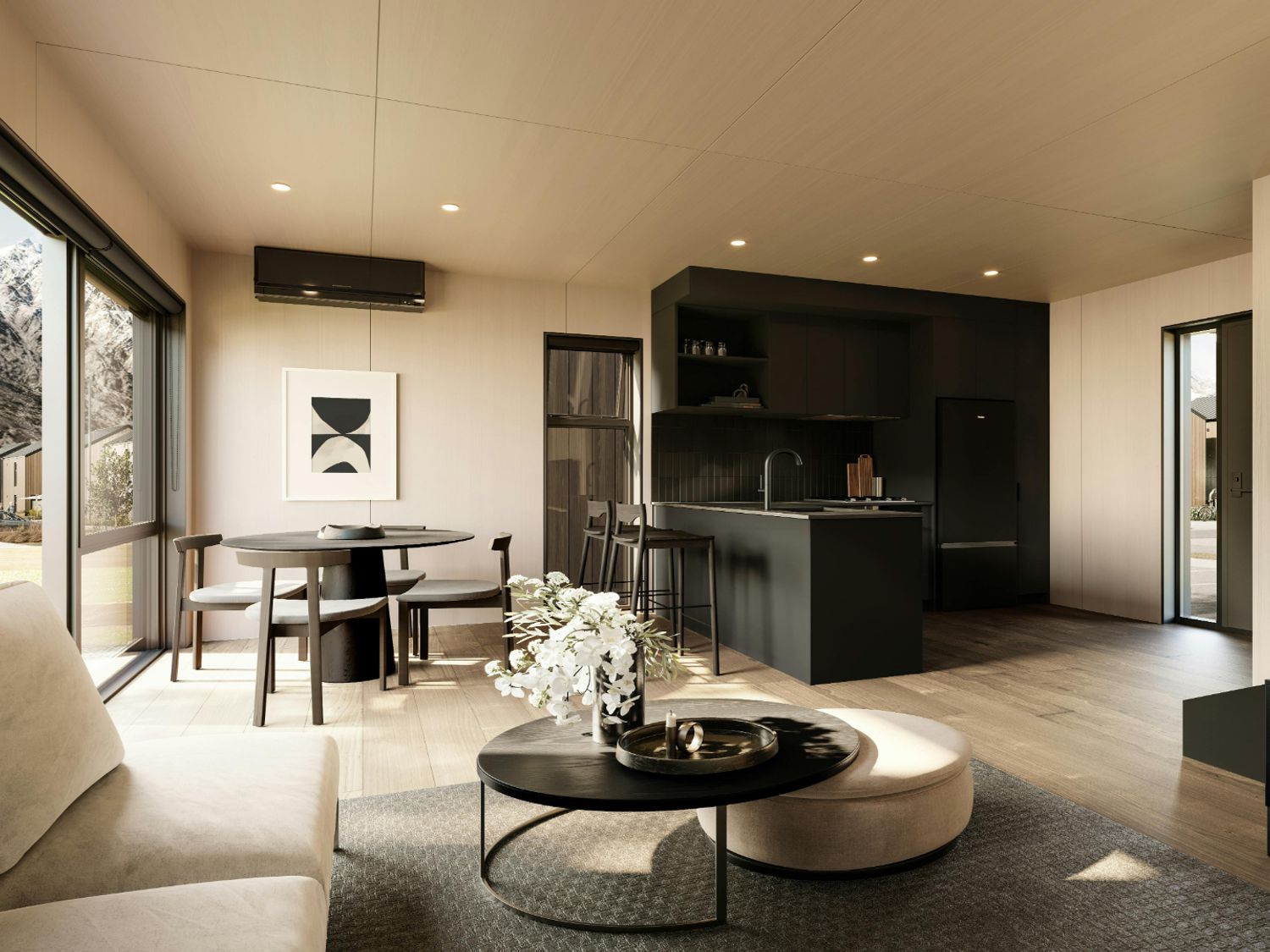 A living room with a dining table and kitchen appliances at Pinnacle Peaks - Queenstown Holiday Home in Queenstown