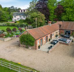 An outdoor area with a building and garden at Sykes Lodge in Malton