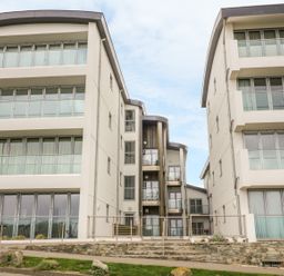 Modern apartment buildings with balconies and large windows at 28 Zenith in Porth