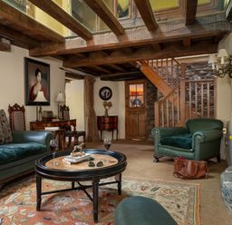 A living room with a coffee table and sofa at The Meeting House in Ashburton