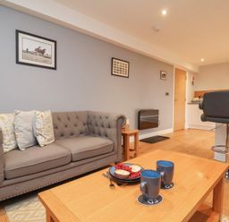 A living room with a sofa and coffee table at Premier, Transit & Lady Hilda @ Engine Shed, Whitby