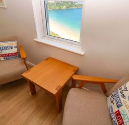 A snug with two chairs and a table at Meridian in Carbis Bay