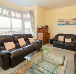 A living room featuring sofas and a coffee table at Preswylfa, Caernarfon