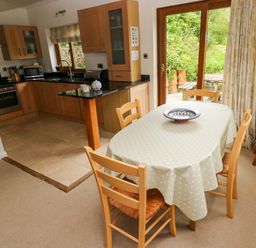 A kitchen with a dining area at Brynawelon in Newport, Pembrokeshire