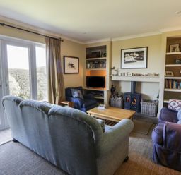 A living room with a coffee table and sofa at Dolwylan in Newport, Pembrokeshire