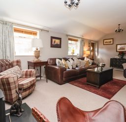 A living room with sofas and a coffee table at 1 Church Barns Pocklington
