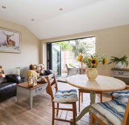 A living room with a table and chairs at 1 Church Barns in Pocklington