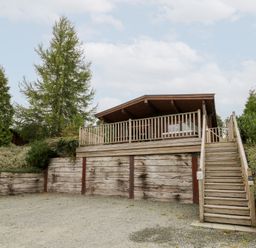 A house with a deck and stairs at Mountain View in Rhayader